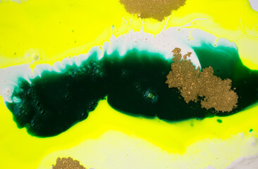 Green and yellow acrylic paints with gold glitter.