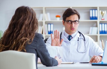 Young doctor in medical insurance fraud concept