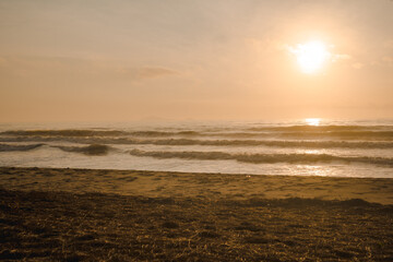 silhouette man run on beach with sunrise and sea background