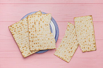 Jewish flatbread matza for Passover on wooden background