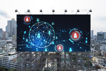 Glowing Social media icons on road billboard over panoramic city view of Bangkok, Southeast Asia. The concept of networking and establishing new connections between people and businesses.