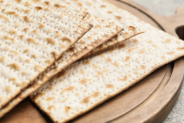 Jewish flatbread matza for Passover on table, closeup