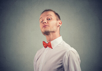Portrait of a snobby man looking at camera