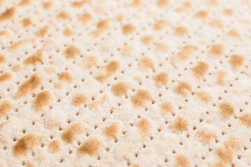 Jewish flatbread matza for Passover as background
