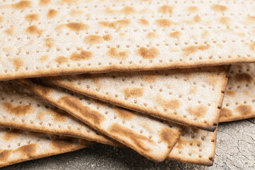 Jewish flatbread matza for Passover on table, closeup