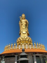 Fototapeta na wymiar Statue of Guanyin on the territory of Buddhist center.