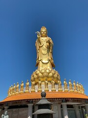 Fototapeta na wymiar Statue of Guanyin on the territory of Buddhist center.
