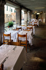 Venice (Italy). Restaurant next to one of the canals of the city of Venice