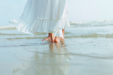 foot of romantic time loving couple dance on the beach. Love travel concept. Honeymoon concept.