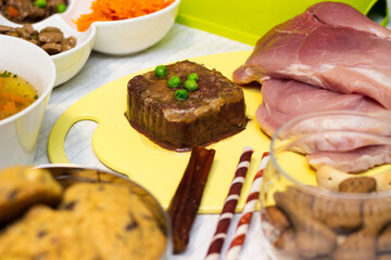 Preparing natural organic food for pets at home. Raw ingredients for pet food in bowl