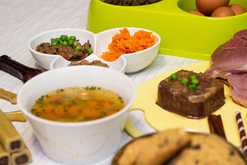 Preparing natural organic food for pets at home. Raw ingredients for pet food in bowl