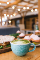Matcha green tea latte in a cup. Top view. Copy space.