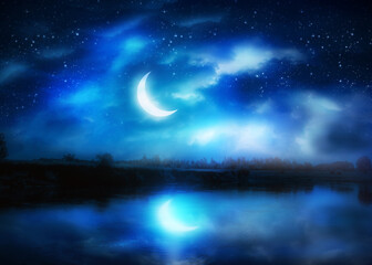 Obraz na płótnie Canvas Crescent moon above river