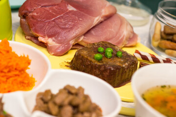 Preparing natural organic food for pets at home. Raw ingredients for pet food in bowl
