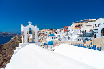 Architecture and landscape of the Santorini island., famous luxury travel vacation getaway. Oia white village with Blue Domes and mills. Amazing warm sunny day