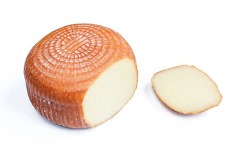 Smoked Kashkaval cheese sliced on white background. Balkan delicatessen made of milk