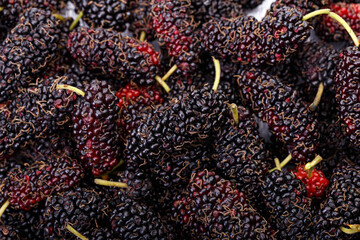 Ripe mulberries background. healthy fruit