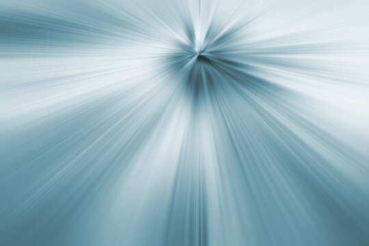 Blurred speed lights, abstract background. Blue-gray exploding rays, zooming effect
