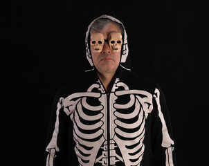 man in halloween skeleton clothing, man in hood