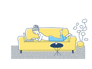 ソファーでノートパソコンを操作する女性