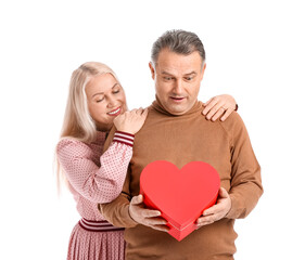 Mature couple with gift on white background. Valentine's Day celebration