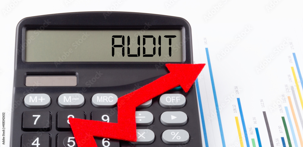 Poster calculator with red ascending arrow and text audit on the display,concept