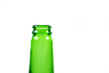 the neck of an empty green frozen beer bottle on a white background