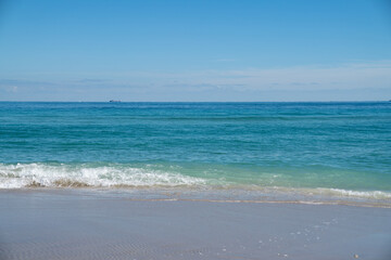 waves crashing at a beautiful blue beach in florida