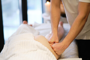 Obraz na płótnie Canvas masseur makes anticellulite massage young woman in the spa salon. Body care concept. Special anticellulite treatment.