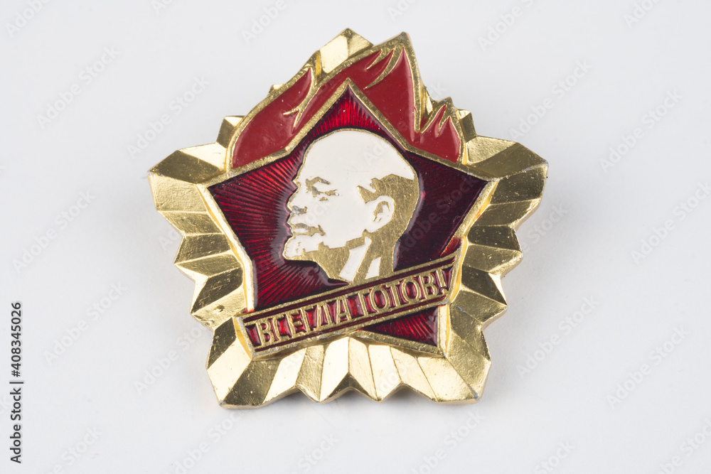 Wall mural soviet metallic badge on white background