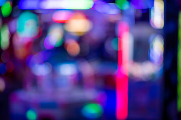 Abstract defocused pattern of neon lights in arcade