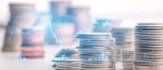Double exposure Candle stick graph chart with indicator image of coin stacks on technology financial graph background. Finance and investment concept. Selective focus.