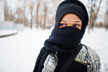 Fototapeta na wymiar African muslim woman wear in black hijab scarf pose in winter day at Europe.