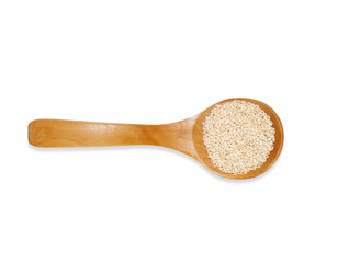 Top view  wooden spoon with white sesame seeds isolated on a white background. Kitchen utensil and cooking ingredients template.