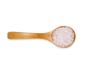 Top view  wooden spoon with white sea salt  isolated on a white background. Kitchen utensil and cooking ingredients template.