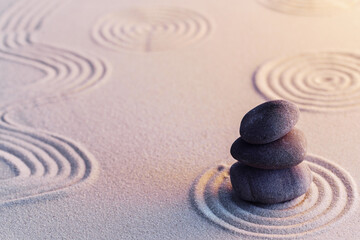 Fototapeta na wymiar Meditation zen garden with stones on sand