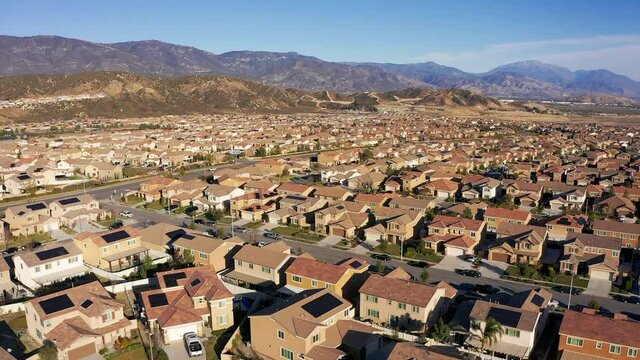 Aerial orbital shot above a desert master-planned housing development. HD at 60 FPS.