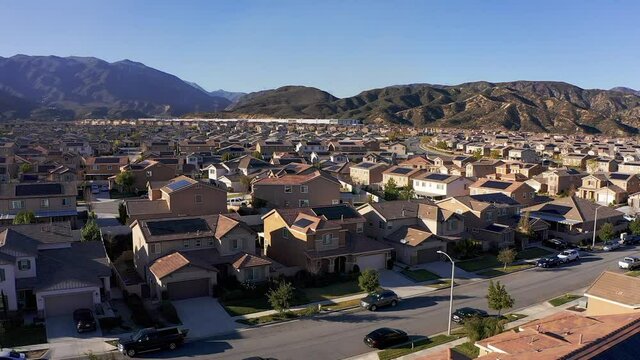 Wide pull-back aerial shot of a desert master-planned community. HD at 60 FPS.