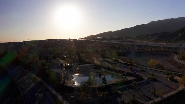 Panning aerial shot above a community pool in a desert master-planned development. HD at 60 FPS.