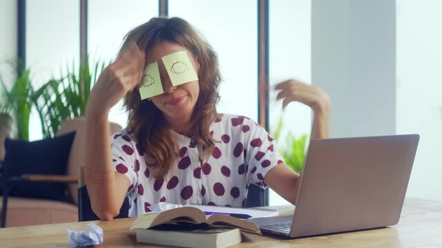 Sleeping Female Office Worker Covering Her Eyes With Sticky Notes. Inefficient Tired Woman Employee Pretends Working Sleeping With Stickers On Face Sits At Desk. Cheating To Sleep Concept