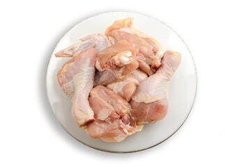 Raw chicken meat on a plate. Isolated on a white background.The view from the top. Healthy eating