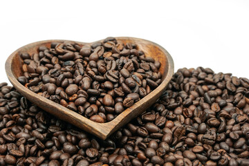 Coffee beans in wooden bowl on white background for valentines day concept.
