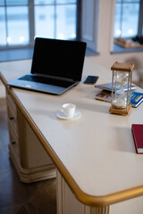 Computer and a cup of coffee on the desktop