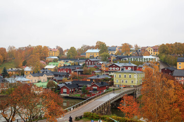 Beautiful panorama of the embankment
rivers and urban architecture, bridge, colored houses, roofs and churches of the city of Porvoo in finland