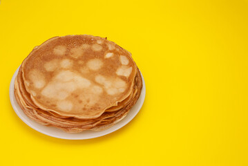 Cooking pancakes. Shrovetide (Maslenitsa) - blini stack on a white plate