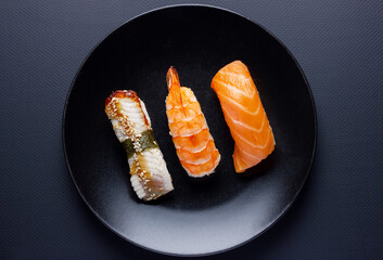 Close up of sashimi sushi set on black background.