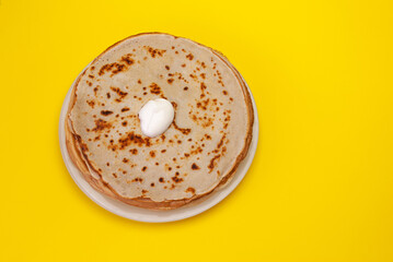 Cooking pancakes. Shrovetide (Maslenitsa) - blini stack on a white plate