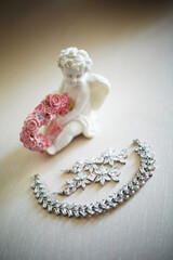 Valentines day gift idea. Bridal jewelry. White ceramic angel with earrings and bracelet.  Engagement present.