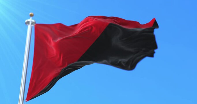 Anarchist flag waving at wind in slow. Loop