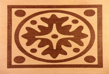 Intricate pattern of beech and mahogany inlays.